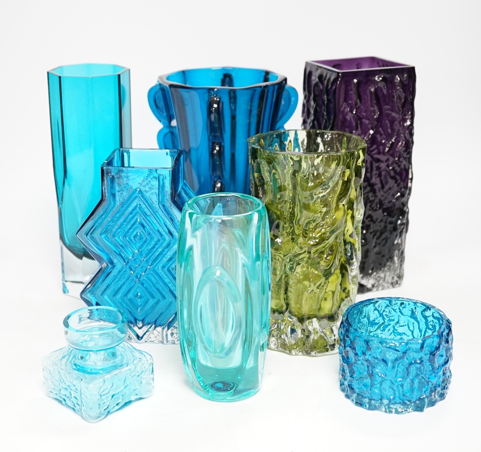 Eight coloured glass vases, including Whitefriars mobile phone vase in kingfisher blue, 22cm high